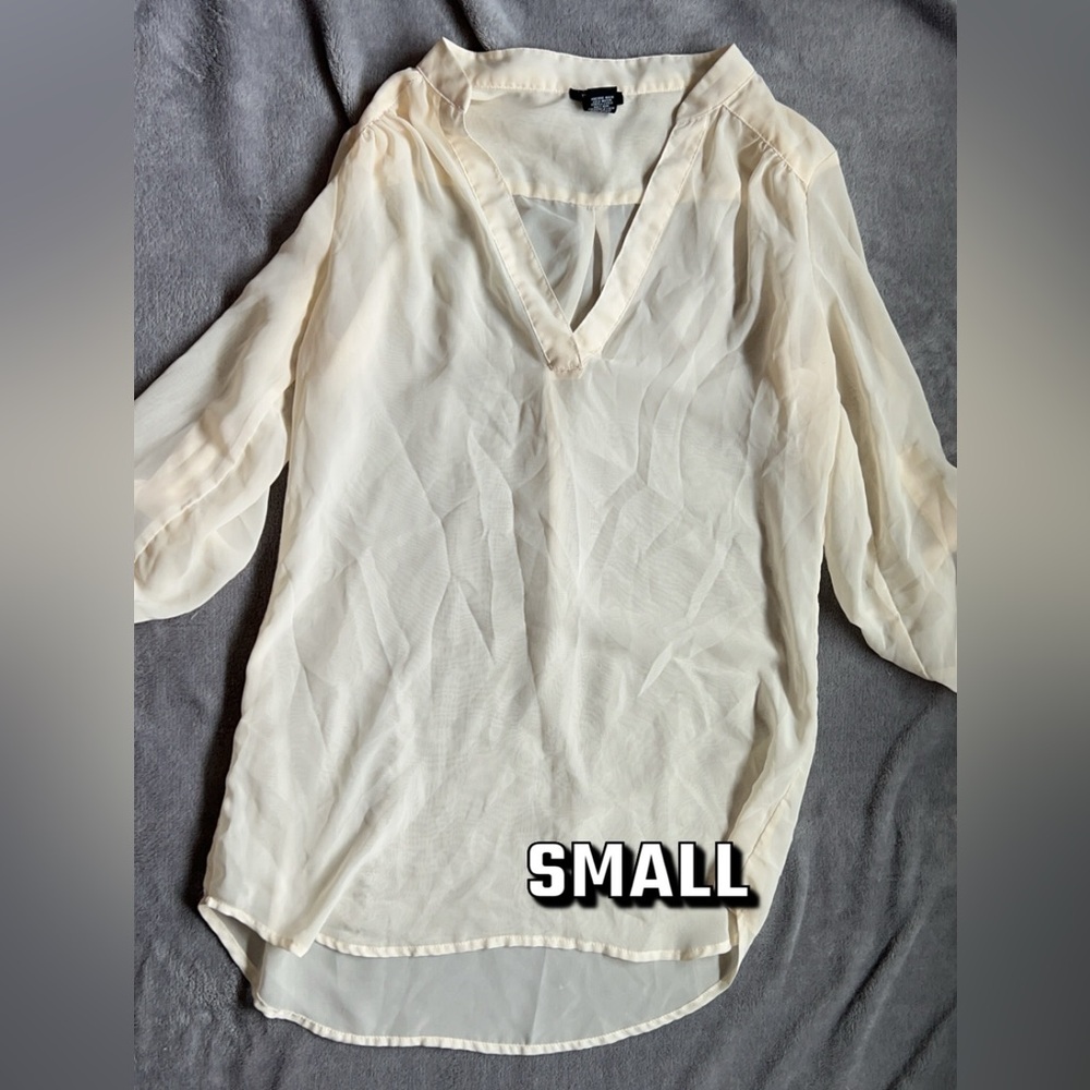 Small sheer white shirt.